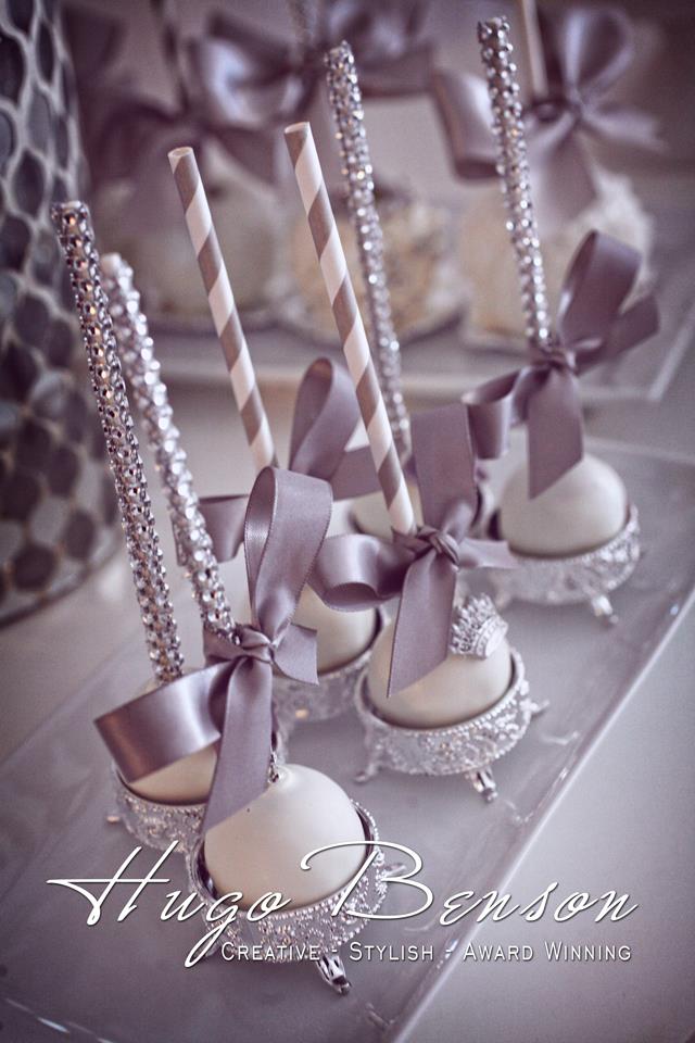 Quinceanera celebration with a photograph of Wedding Ceremony Supply and a bunch of cake pops sitting on top of a table