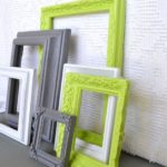 A colorful display of frames on a wall for a Quinceanera theme.
