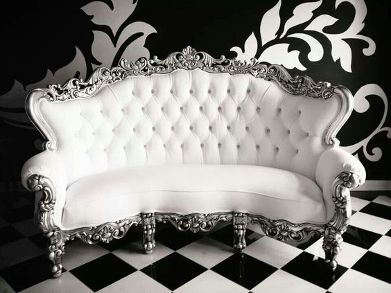 Quinceanera style white couch sitting on top of a checkered Quinceanera theme floor