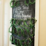 Flora Diaper, a chalk board with a chalk board saying be wild and grow wild for a Quinceanera