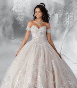 Enchanted forest themed Quinceanera dresses and a woman in a Quinceanera dress posing for a picture