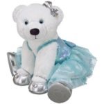 A white teddy bear wearing a blue dress, representing Quinceanera theme
