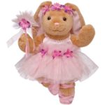 A Quinceanera doll Bears, a teddy bear dressed in a pink dress and holding a flower