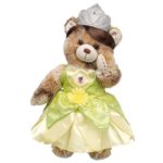 A Quinceanera-themed image featuring a teddy bear dressed in a green dress surrounded by princesses bears.