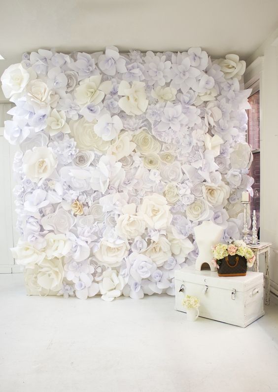 Quinceanera, a wall of DIY paper flowers serving as decorative wall decor in a room