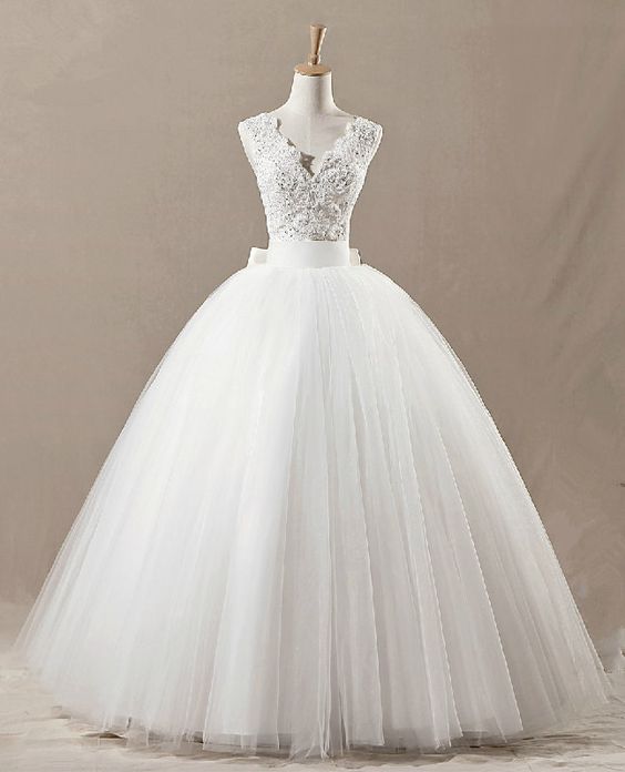 An elegant puffy white Quinceañera dress on a mannequin