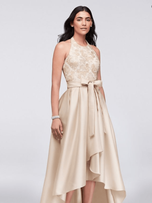 Quinceanera fashion model Dress, a woman wearing a champagne colored dress with a high low - low skirt