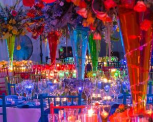 Quinceanera celebration with a Candyland theme, featuring a room filled with lots of tables and chairs