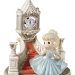 A Quinceanera figurine of a girl in a blue dress from Precious Moments
