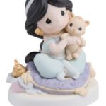 A Quinceanera figurine of Jasmine, a girl holding a cat
