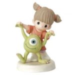 Quinceanera figurine, a figurine of a little girl riding a toy
