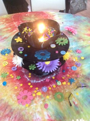 Cake decorating, a Quinceanera cake with a lit candle on top of it