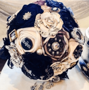 Quinceanera flower bouquet, a bridal bouquet sitting on top of a table