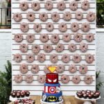 Doughnut, a table topped with a cake covered in donuts at a Quinceanera