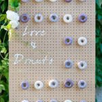A pegboard featuring a variety of delicious donuts, perfect for a Quinceanera celebration.