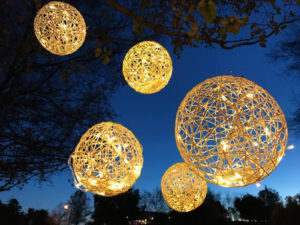 A Quinceanera party with a bunch of lights in the air