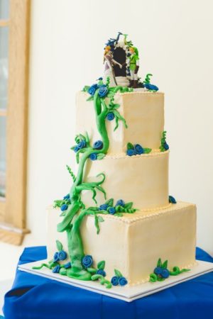 A Quinceanera cake, a three-tiered cake with blue flowers and vines in the style of the Legend of Zelda