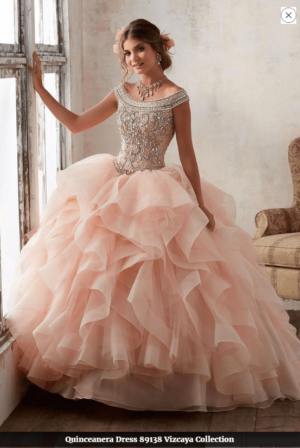 Quinceañera dress creation, a woman in a ball gown posing for a picture at vestidos de 15 años 2018