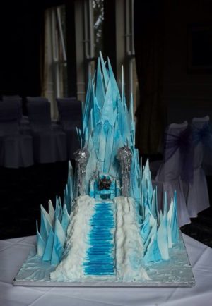A Quinceanera cake, beautifully decorated and placed on a table