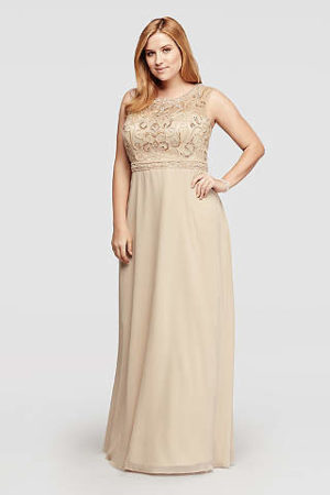 Quinceanera - A woman in a long dress posing for a picture on her special day