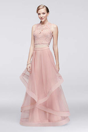 A woman in a long pink Quinceanera gown