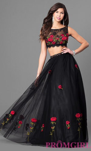 A Quinceanera gown, featuring a woman in a black dress adorned with roses