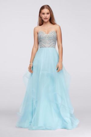 A woman in a long blue dress, wearing a Quinceanera gown