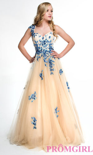 A woman in a Quinceanera gown dress posing for a picture