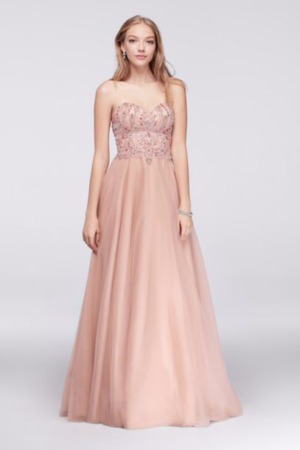 A woman in a long pink Quinceanera gown