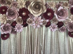 Quinceanera image: a large flower bouquet on a silver curtain