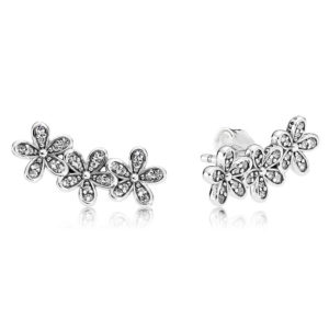 A pair of diamond earrings with daisies on a white background