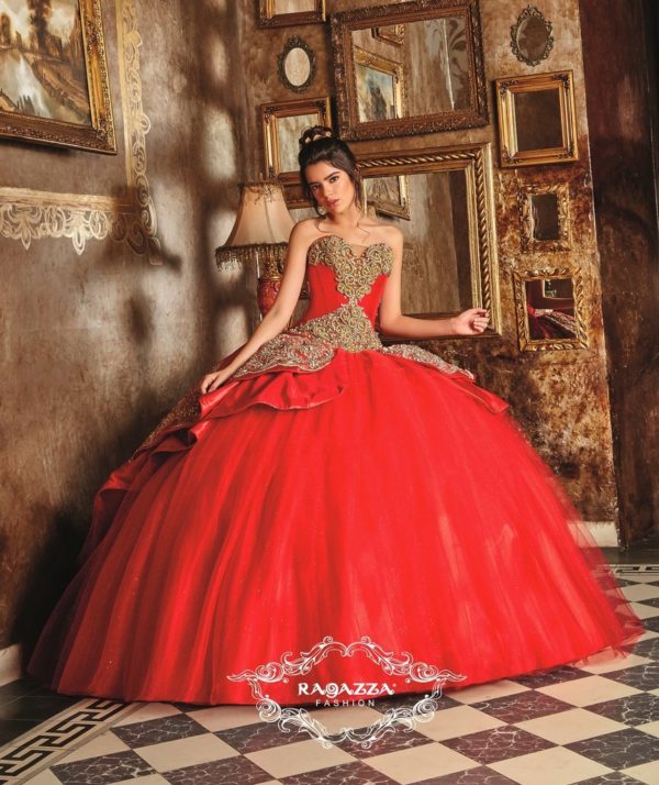 Quinceañera beauty and the beast quinceanera dress. A woman in a red dress posing for a picture.
