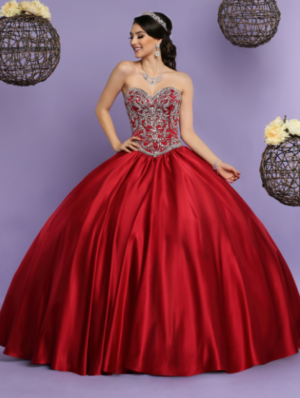 Quinceanera image: Q By DaVinci, a woman in a red ball gown posing for a picture