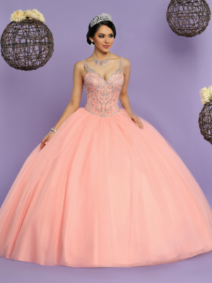 A woman in a ball gown posing for a picture wearing Quinceañera dresses