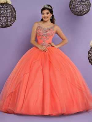 A woman in a Quinceanera ball gown posing for a picture