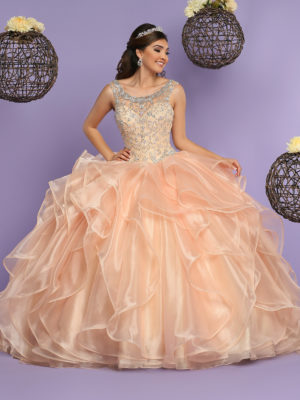 A woman in a ball gown posing for a picture wearing Quinceañera dresses