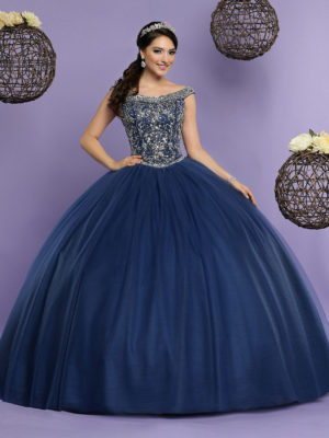 Quinceanera dress, a woman in a ball gown posing for a picture
