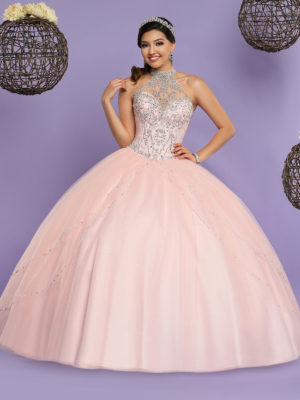 Quinceañera dresses, a woman in a ball gown posing for a picture at the top of Quince dresses