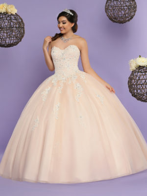 A woman in a ball gown posing for a picture in Quinceañera dresses