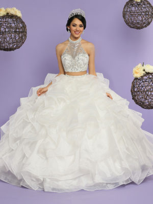 Two piece Quinceanera dresses, a woman in a Quinceanera dress posing for a picture