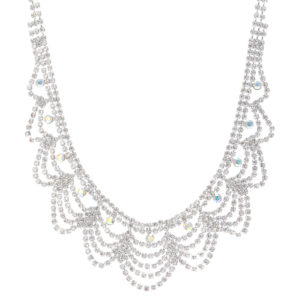 A Quinceanera themed image featuring a Disneyland Park earring and a necklace adorned with a lot of crystals.