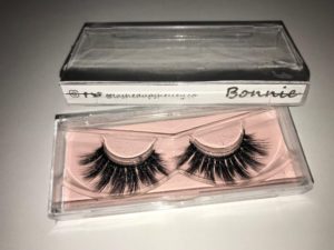 A box containing a pair of false lashes and eyelash mascara for Quinceanera celebration.