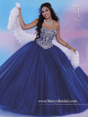 Quinceanera: A woman in a blue ball gown posing for a picture