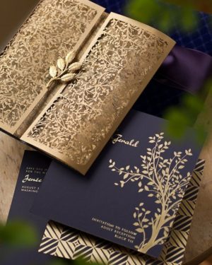 A unique Quinceanera invitation card - an open book sitting on top of a table