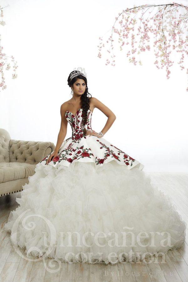 Quinceañera dresses, a woman in a white and red dress sitting on a couch, charro quinceanera dresses