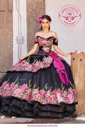 Quinceanera image: A woman wearing a charro quince dress featuring black and pink colors.