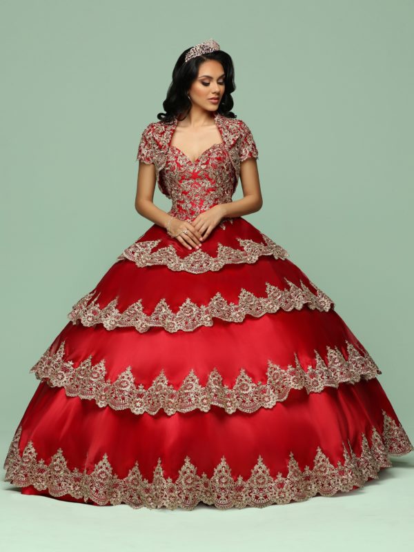 A woman in a red ball gown posing for a picture wearing Quinceañera dresses