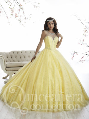 A woman in a yellow Quinceanera ball gown posing for a picture