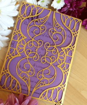 A close up of a Jasmine theme Quinceanera card with flowers on a table.