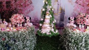 A Quinceanera cake topped with a beautiful floral design